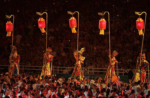 Volunteers perform during the closing ceremony of the Athens 2004 Olympic Games August 29, 2004. The next summer Olympic Games will be held in Beijing in 2008. REUTERS/Mike Blake