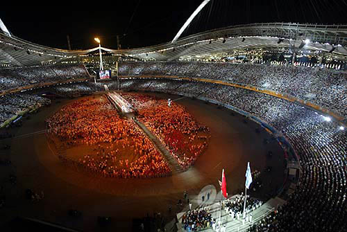 A general view of the athletes gathered in the Olympic Stadium during the closing ceremony of the Athens 2004 Olympic Games August 29, 2004. The next summer Olympic Games will be held in Beijing in 2008. REUTERS/Marcos Brindicci