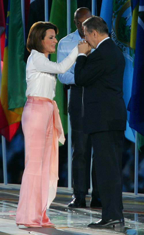 President of the International Olympic Committee Jacques Rogge (R) kisses the hand of President of the Athens 2004 Organising Committee for the Olympic Games Gianna Angelopoulos-Daskalaki (L) during their official speeches at the closing ceremony of the Athens 2004 Olympic Games August 29, 2004. The next summer Olympic Games will be held in Beijing in 2008. REUTERS/Mike Blake