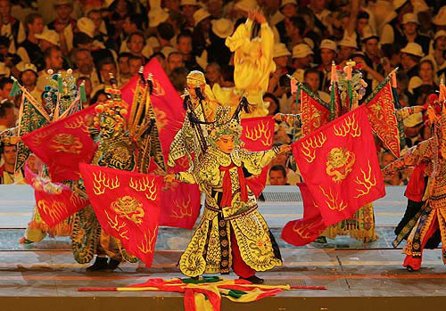 Volunteers perform during the closing ceremony of the Athens 2004 Olympic Games August 29, 2004. The next summer Olympic Games will be held in Beijing in 2008. REUTERS/Lucy Nicholson
