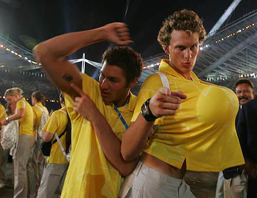 Members of Australia's water polo team dance during the closing ceremony of the Athens 2004 Olympic Games August 29, 2004. The next summer Olympic Games will be held in Beijing in 2008. REUTERS/Adrees Latif