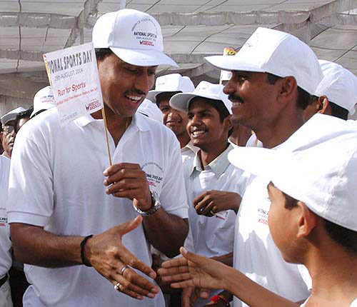 The only Indian medallist from Athens, Major Rajyavardhan Singh Rathore, shakes hands with a young fan during the national sports day celebrations in Delhi on August 29.