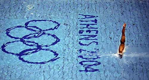 A diver dives from 6m springboard during a free training session in the Olympic aquatic centre in Athens on August 5, eight days before of start of the Athens 2004 Olympic Games.