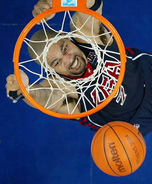 Carlos Boozer slam dunks during their men's basketball quarter-final against Spain at the Athens 2004 Olympic Games on August 26.