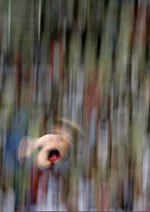 Russia's Svetlana Timoshinina spins as she dives during the women's 10 metre platform preliminary at the Athens 2004 Olympic Games on August 20.