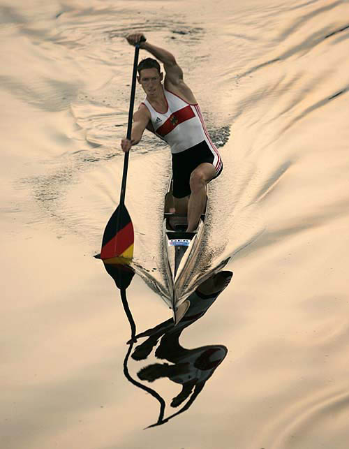 German canoeist Andreas Dittmer heads out to train prior to the finals of the flatwater canoeing at the Athens 2004 Olympics on August 27. Dittmer took the silver medal in the men's C1 1000-metre.