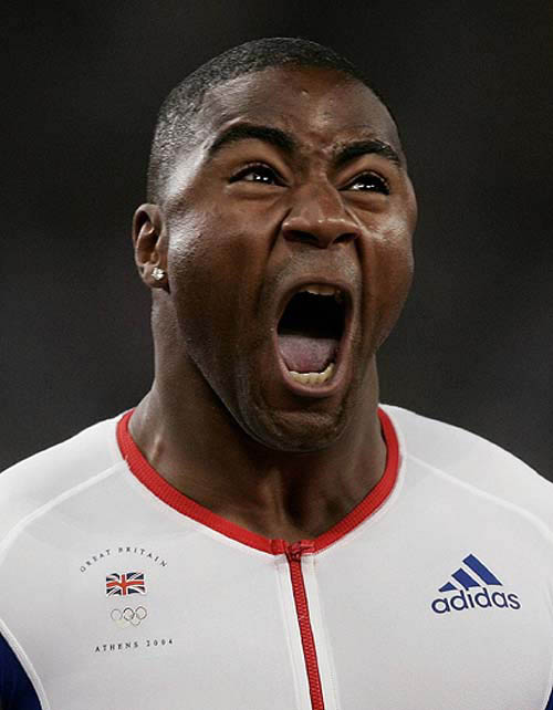 Britain's Mark Lewis-Francis celebrates as he crosses the finish line to win the men's 4 x 100 metres relay final at the Athens 2004 Olympic Games on August 28. Britain won the gold medal in a time of 38.07 seconds ahead of the U.S. and Nigeria.