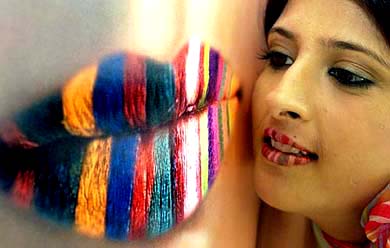 A model poses for photographers during the launch of a new cosmetic range in Chandigarh on Tuesday