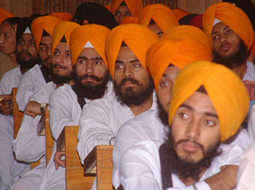 Sikh youths listening to the speech of a Sikh scholar at a seminar