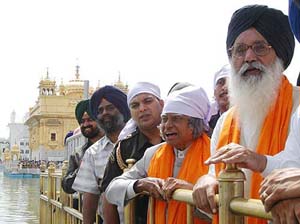 Dr A.P.J. Abdul Kalam, President of India, and Mr Parkash Singh Badal coming out of the Golden Temple after paying obeisance on the occasion of the 400th installation ceremony of Sri Guru Granth Sahib in Amritsar on Tuesday. 