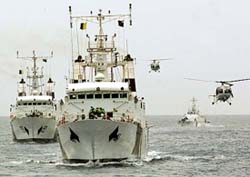 Indian Coast Guard ships and helicopters take part in a demonstration in Chennai on Tuesday. 