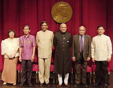 The 2004 Ramon Magsaysay awardees pose for photographers during a ceremony in Manila on Tuesday