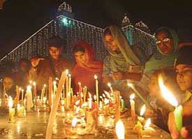 Devotees light candles at Gurdwara Sacha Dhan in Phase 3B1, Mohali, to mark the 400th anniversary of Guru Granth Sahibs installation