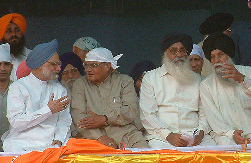 Prime Minister Manmohan Singh making a point to former Prime Minister Atal Bihari Vajpayee