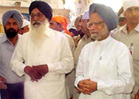 Prime Minister Manmohan Singh and Mr Parkash Singh Badal after paying obeisance at Golden Temple