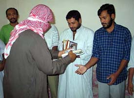 Captive truck drivers receive gifts before their release from a Baghdad building on Wednesday