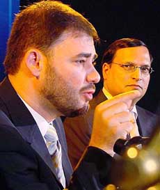 Managing Director for Qatar based television channel Al Jazeera Wadah Khanfar (left) and Chairman of India TV Rajat Sharma address mediapersons in New Delhi