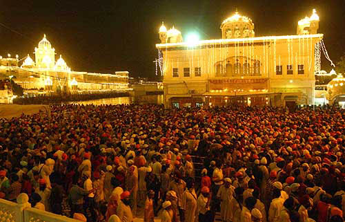 The Sikhs crowd the holy Golden Temple in the Amritsar on August 31 for the 400th anniversary celebration of the compilation and installation of the Sikh sacred book.