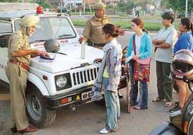 The Panchkula police challans helmetless women drivers near Sector 4 on Friday evening.