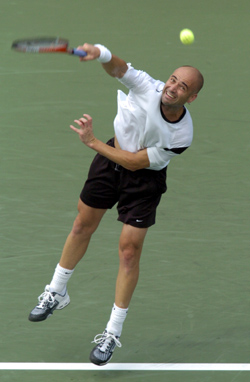 Andre Agassi of the USA serves to Florian Mayer of Germany during the US Open on Thursday. Agassi won the match when Mayer retired