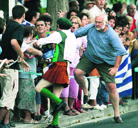 Cornelius Horan tries to push Vanderlei de Lima into the spectators.