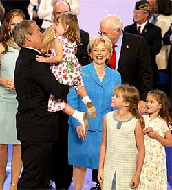 US President George W. Bush holds Vice-President Dick Cheneys granddaughter Grace Perry