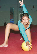 A gymnast performs with the ball in the rhythmic event at the 32nd Chandigarh State Gymnastics Championship at ITBP Hall, Behlana