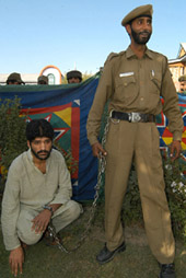 Shahnawaz, a suspected militant, being produced in front of the media at Anantnag, 53 km from Srinagar. The police produced eight suspected militants. 