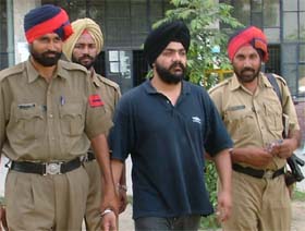 Dr Harjit Singh Kohli comes out of a court in Ludhiana after getting police remand
