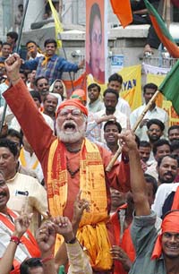 A BJP worker shouts slogan on the 4th day of the BJP's week-long Satyagraha demanding withdrawal cases against Uma Bharati, in Bangalore