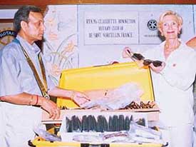 Rtn Ms Claudette Bonnetron hands over 500 pairs of spectacles to Mr Baldev Aggarwal