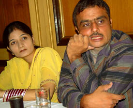 Ms Iram Sultana and her husband Mohammed Shabbir talking to media persons