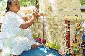 A woman makes bamboo chiks in Sector 22, Chandigarh