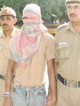 Prime accused Moti in police custody in the Capital on Sunday.