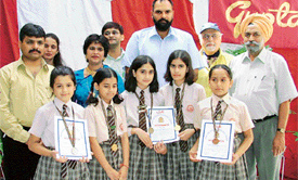 Winners of a debate along with guests at a function held in Gupta Model School on Teachers Day in Ludhiana
