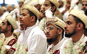 Muslim bridegrooms wait for their turn during a mass marriage ceremony in Mumbai on Monday