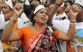 Devotees dance at a procession on the eve of Janmashtami in Dhaka 