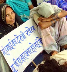 Activists of the Swadeshi Jagran Manch sit on dharna against the growing inflation at Jantar Mantar in New Delhi on Tuesday. 