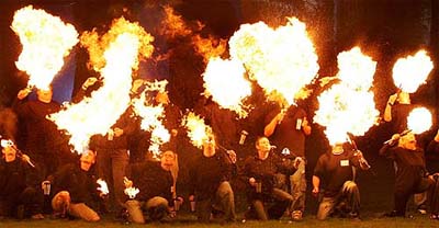 Fire eaters take part in an attempt to break the world record for synchronised fire eating