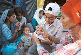 Having gained literacy under the aegis of Theatre Age, slum children of Sector 25, Chandigarh, teach grannies of their area the art of signing on the occasion of International Literacy Day on Wednesday. 
