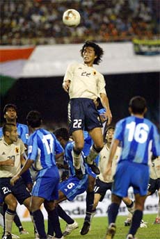 Japans Nakazawa Yuji jumps for the ball during the World Cup qualifying match against India in Kolkata on Wednesday. Japan won 4-0. 