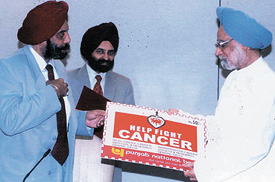 Prime Minister Manmohan Singh releasing the 'Cancer Seals' sponsored by the PNB. Mr S.S.Kohli, the CMD of PNB, is also seen in the picture