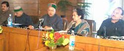 Chief Minister Virbhadra Singh addresses a state-level Planning Development and 20-Point Programme Review Committee meeting in Shimla on Thursday.