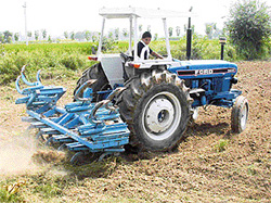 It's no spectacle but it's enough to spike stereotypes: Ms Inderjit Kaur negotiates a turn as she drives her tractor.