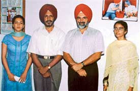 PAU Vice-Chancellor K.S. Aulakh with Sumeet Arneja and Sumit Inder Kaur, who have been admitted to the University