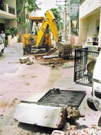 Demolition drive on the Municipal Council under way at Housing Board Colony Sector 15