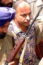 Maninder Pal Kohli, accused in the rape and murder of Hannah Foster in Britain, being taken to Metropolitan Magistrates court by the CBI in New Delhi on Friday.