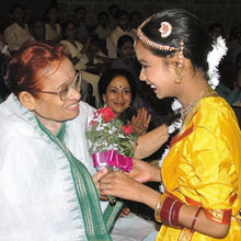 Noted Gandhian and MP Nirmala Deshpande being welcomed by a schoolgirl at a symposium on Families from different faith perspectives. Ms Sharon Lowen, the renowned dancer, is also seen at a function organised by Deepalaya at IIC in New Delhi on Saturday