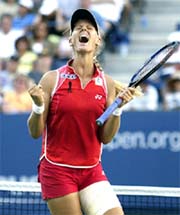 Elena Dementieva of Russia celebrates winning a point in her semifinal match against USAs Jennifer Capriati