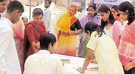 Patients are examined at a medical camp at Kishangarh village in Chandigarh on Sunday